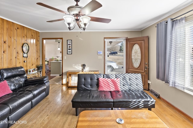 living room with plenty of natural light and wood-type flooring