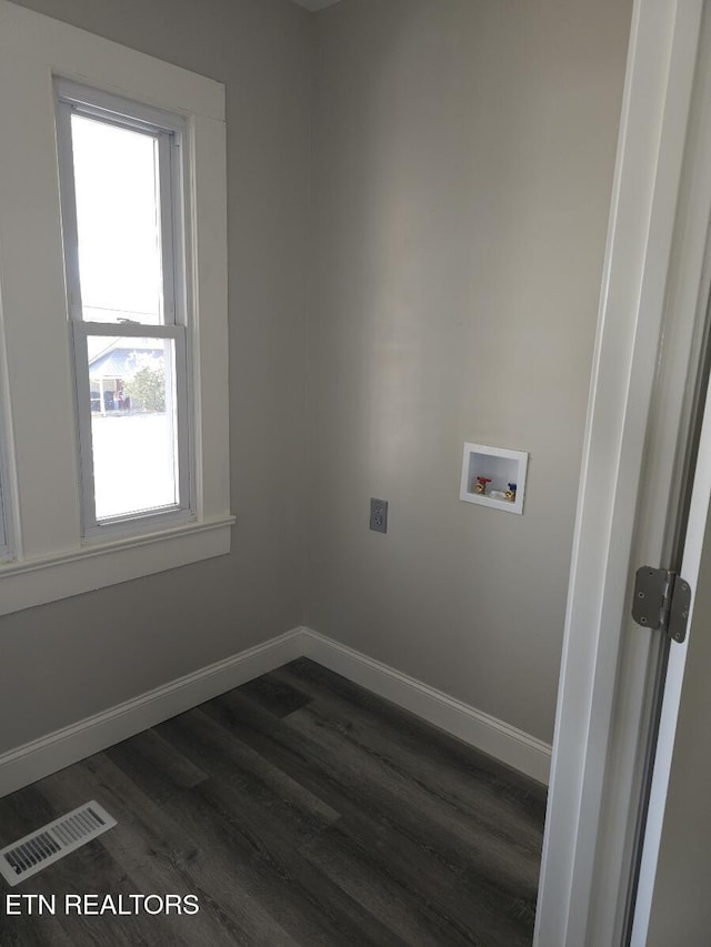 clothes washing area with electric dryer hookup, dark wood-type flooring, and washer hookup