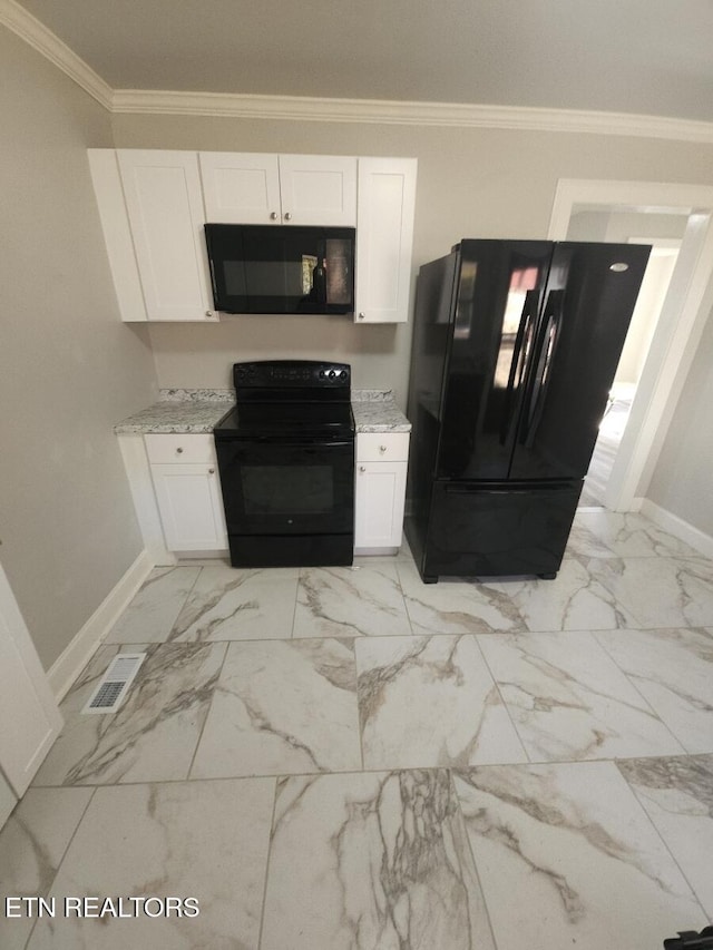 kitchen featuring white cabinetry, ornamental molding, light stone counters, and black appliances