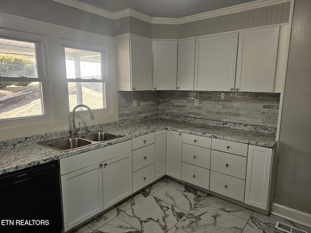 kitchen featuring sink, black dishwasher, tasteful backsplash, light stone countertops, and white cabinets