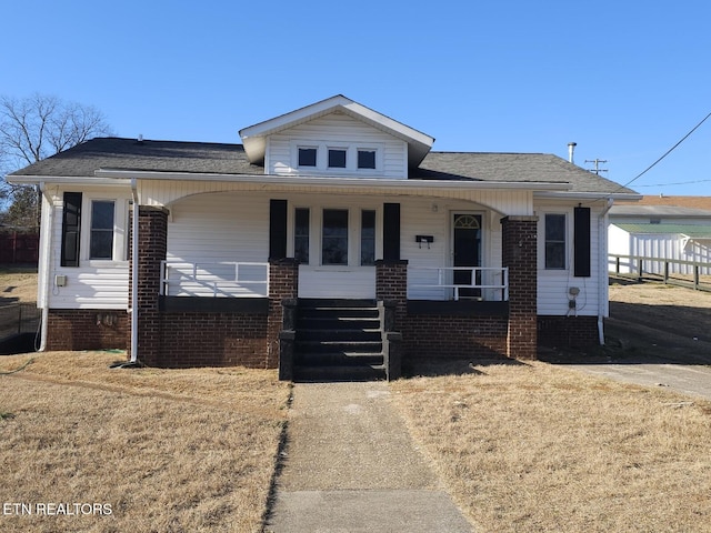 view of front of property featuring covered porch