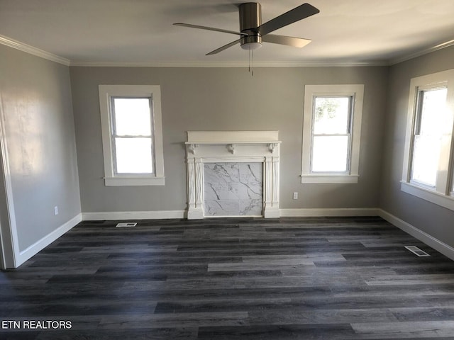 unfurnished living room with crown molding, dark hardwood / wood-style floors, and ceiling fan