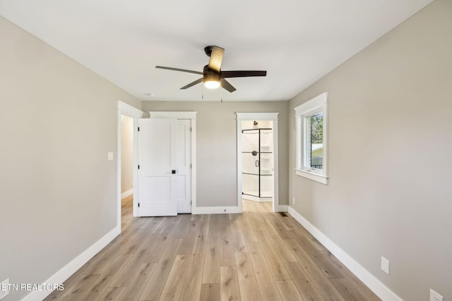 unfurnished bedroom featuring ceiling fan, connected bathroom, and light hardwood / wood-style flooring