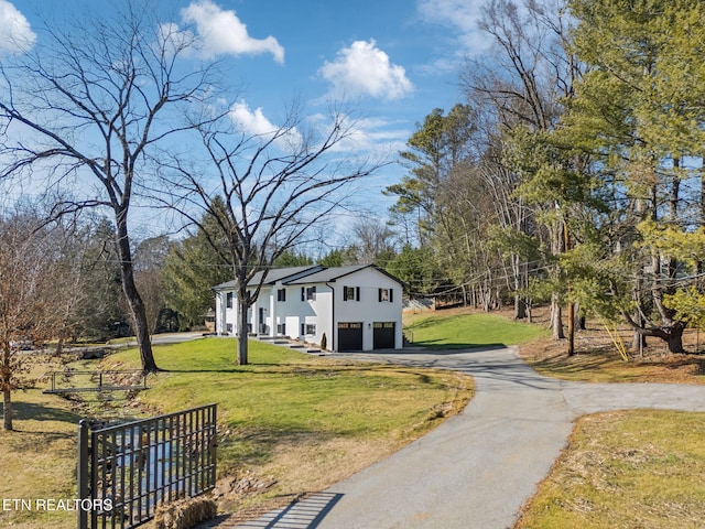 view of property's community with a lawn