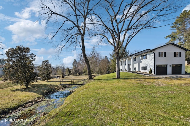 view of yard featuring a garage