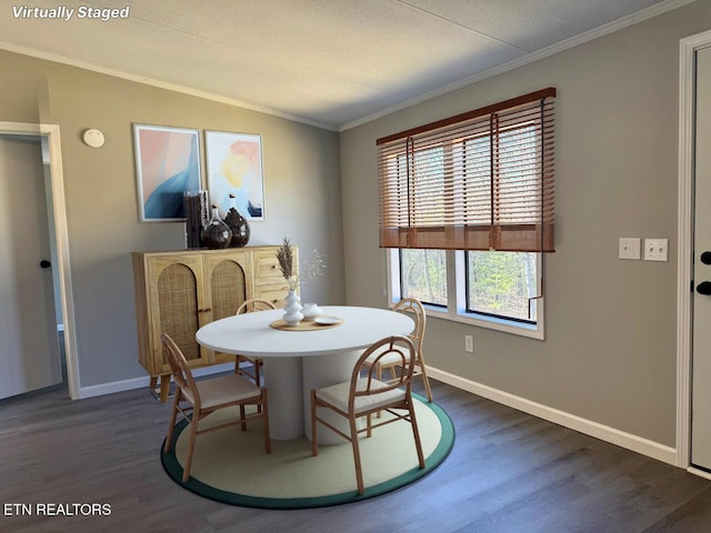 dining room featuring crown molding and dark hardwood / wood-style floors