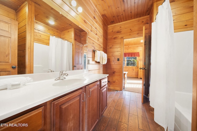 bathroom with wooden walls, hardwood / wood-style flooring, vanity, wooden ceiling, and a shower with curtain