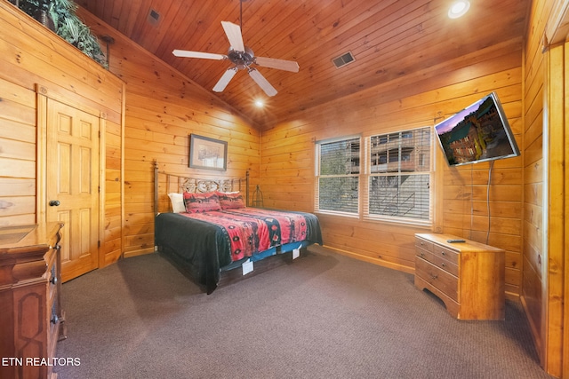 carpeted bedroom with vaulted ceiling, wooden walls, ceiling fan, and wood ceiling