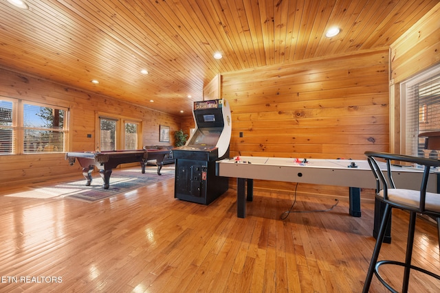 recreation room featuring wood ceiling, pool table, wooden walls, and light hardwood / wood-style floors