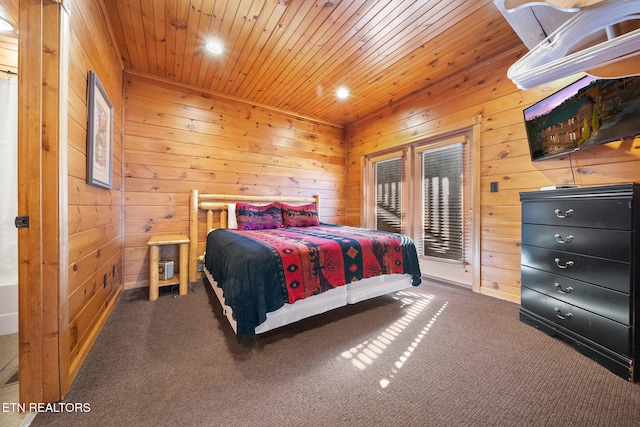 bedroom with wood ceiling, carpet floors, wood walls, and access to outside