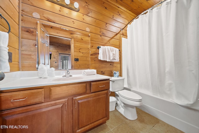 full bathroom with tile patterned flooring, vanity, wooden walls, and toilet