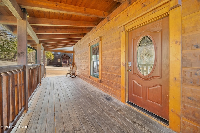 property entrance with covered porch