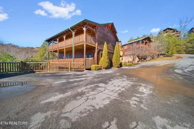 view of front of property with a balcony