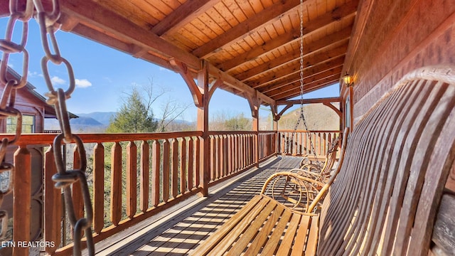 wooden terrace featuring a mountain view