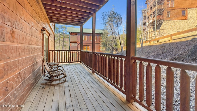 wooden terrace featuring a porch