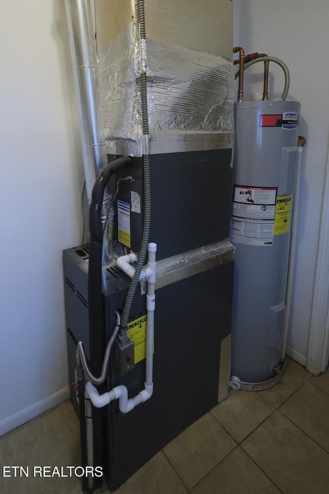 utility room with heating unit and water heater