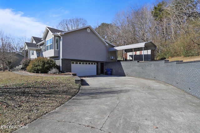 view of side of property featuring a garage and a carport