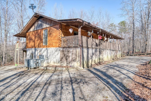 view of side of property featuring central AC unit