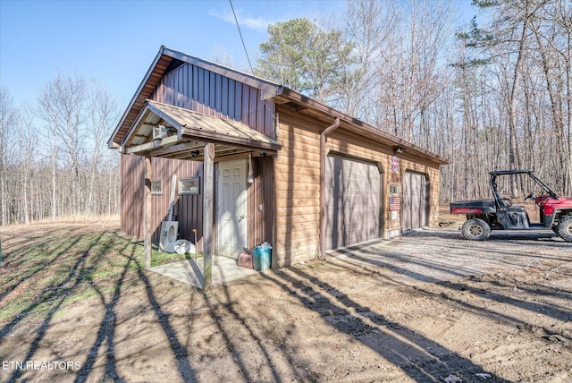 exterior space with an outbuilding and a garage