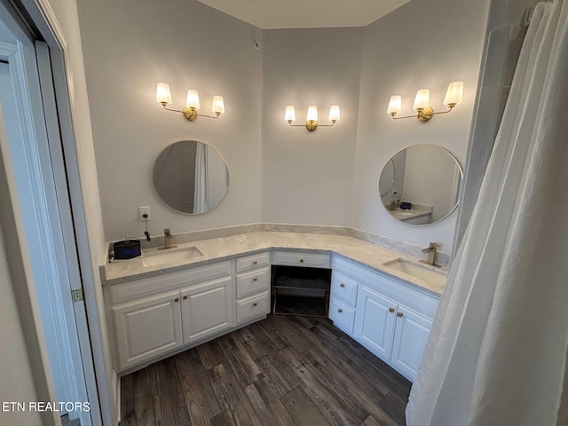 bathroom featuring wood-type flooring and vanity