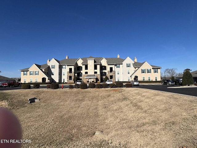 545 Rarity Bay Pkwy Apt 207, Vonore, TN 37885 - view of building exterior featuring a residential view and uncovered parking