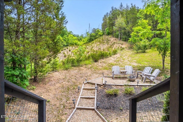 view of yard with a fire pit