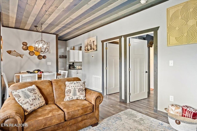 living room with an inviting chandelier, wooden ceiling, and light wood-type flooring