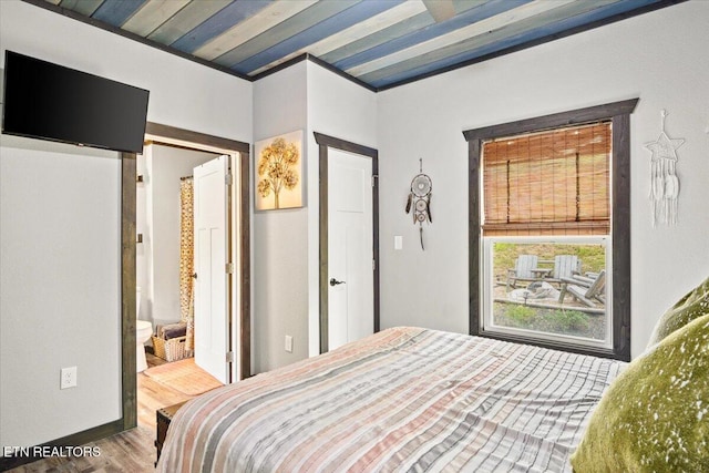 bedroom with wood-type flooring