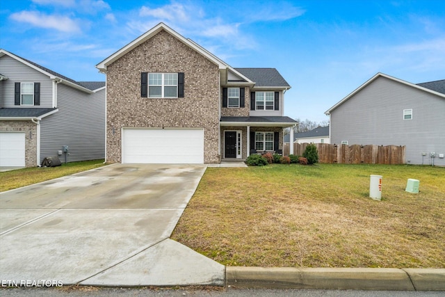 view of front of property featuring a garage and a front lawn