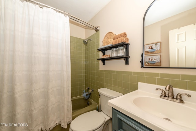 full bathroom with vanity, tile walls, shower / bath combination with curtain, and toilet