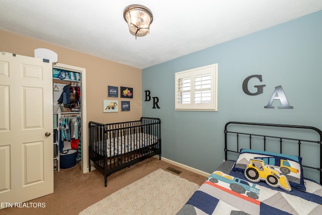 bedroom with light carpet and a closet