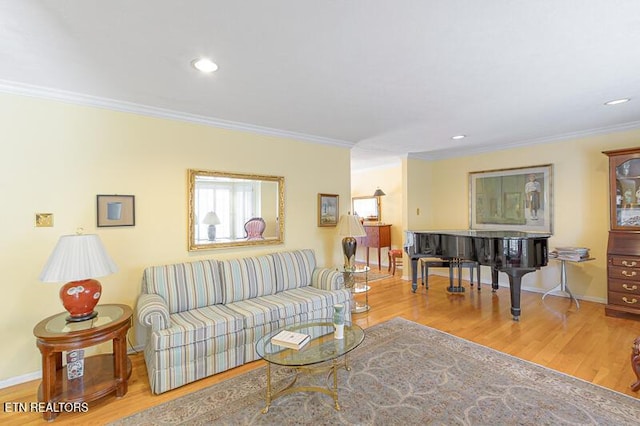 living room featuring crown molding and hardwood / wood-style floors