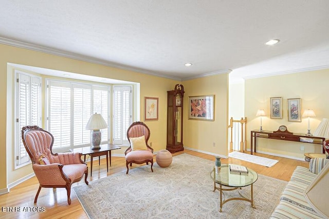 living room featuring light hardwood / wood-style flooring and ornamental molding