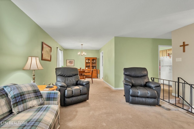 living room with light carpet and a chandelier