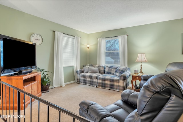 carpeted living room featuring a textured ceiling