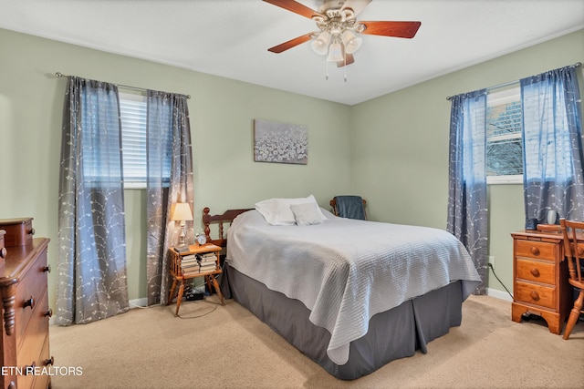 bedroom featuring ceiling fan and light colored carpet