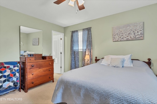 bedroom featuring light colored carpet and ceiling fan