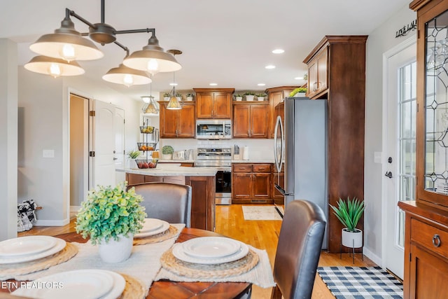 dining area with light hardwood / wood-style floors