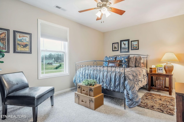 bedroom featuring ceiling fan and carpet