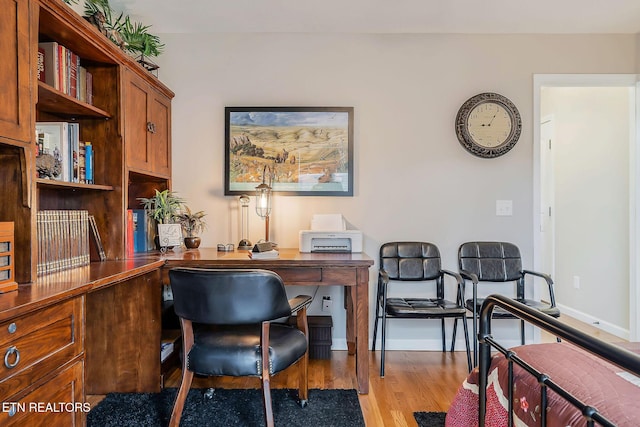 home office with light wood-type flooring