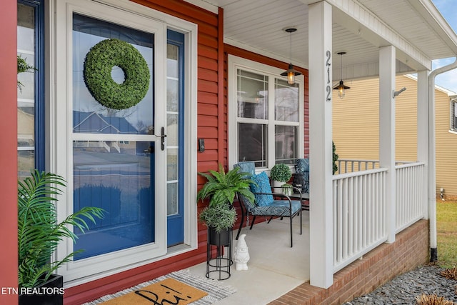 entrance to property featuring covered porch