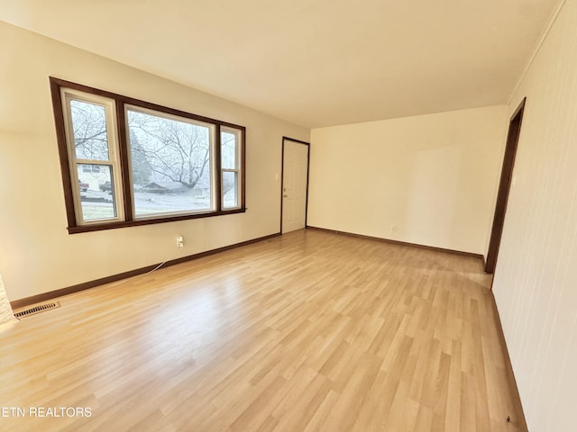 unfurnished room featuring light hardwood / wood-style floors