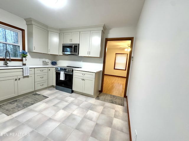 kitchen featuring stainless steel appliances and sink