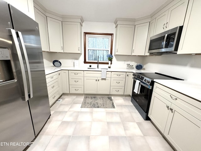 kitchen featuring stainless steel appliances and sink