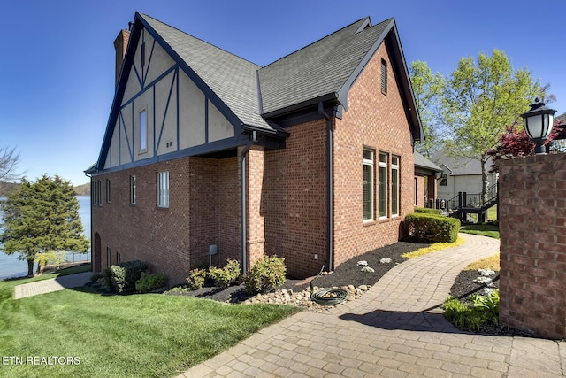 view of home's exterior featuring a patio and a lawn