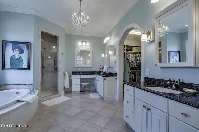 bathroom with crown molding, vanity, independent shower and bath, and a chandelier