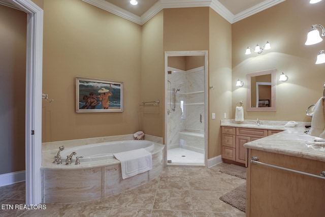 bathroom with vanity, ornamental molding, and plus walk in shower