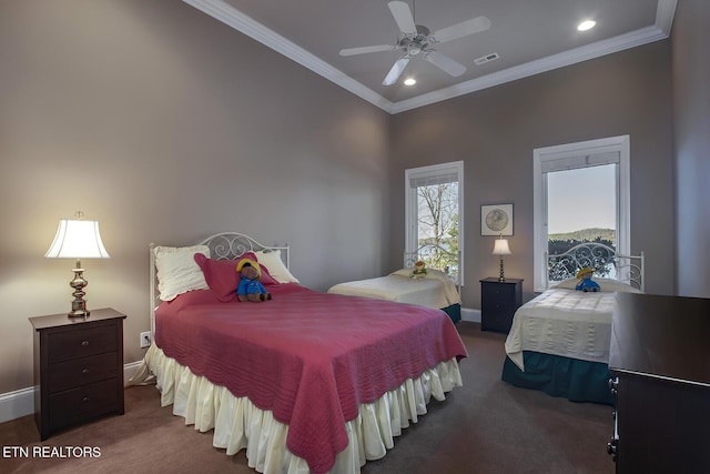 bedroom with ornamental molding, ceiling fan, and dark colored carpet