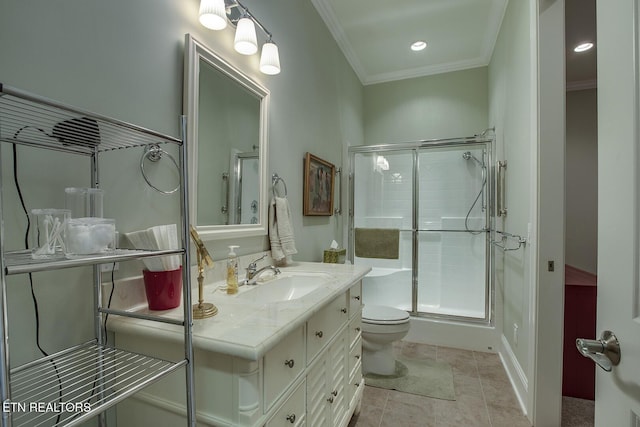 bathroom with crown molding, tile patterned flooring, vanity, a shower with shower door, and toilet