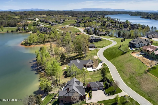 bird's eye view with a water and mountain view